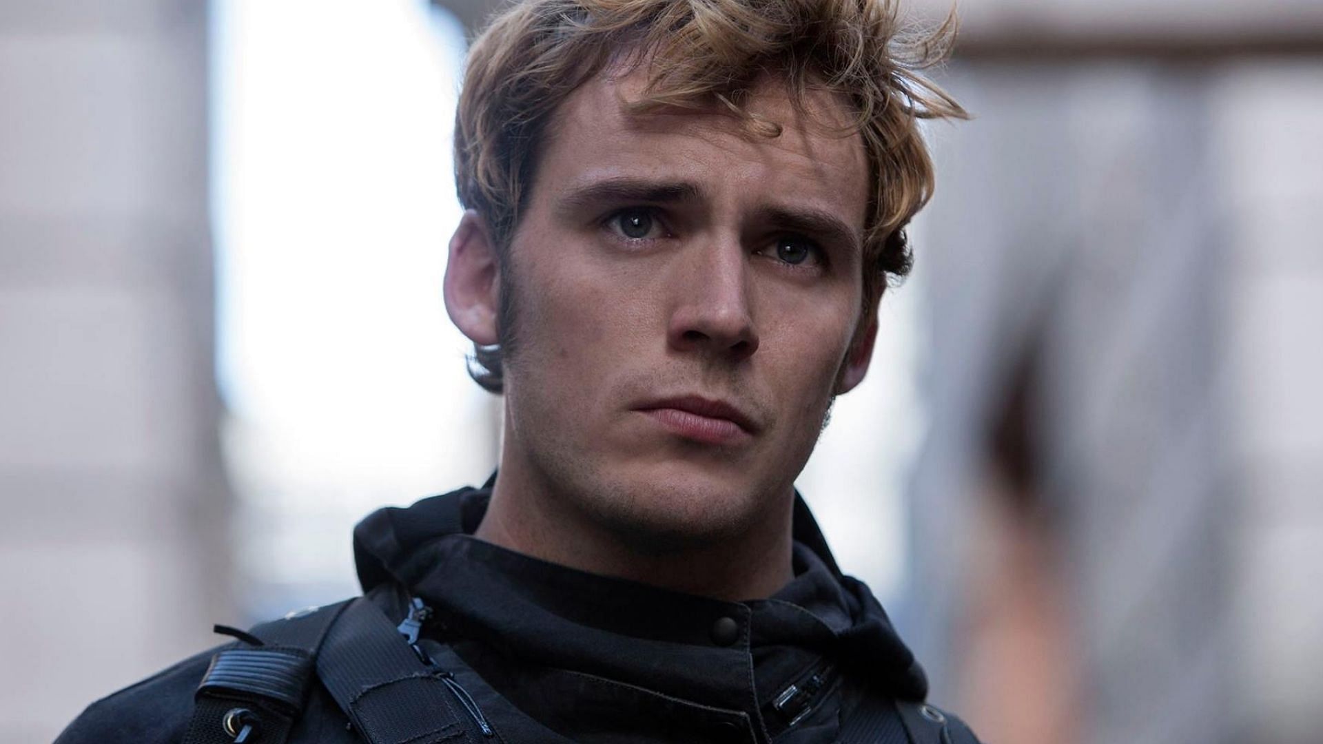 Sam Claflin stars as Finnick Odair (Image via Facebook/The Hunger Games)